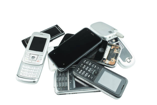 istock Old and obsolete cell phone isolated on white background. 1370913114