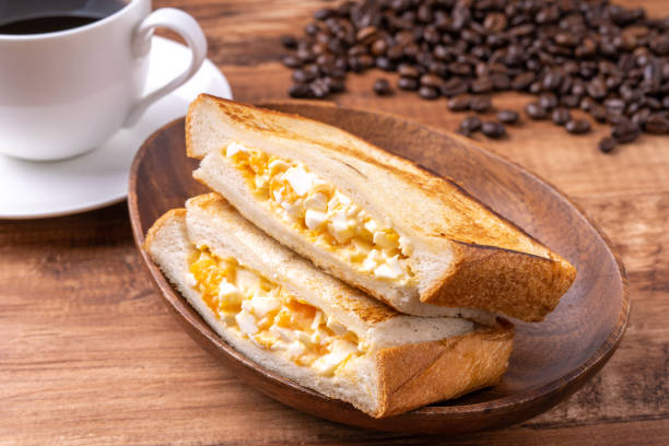 Hot egg sandwich and coffee stock photo
