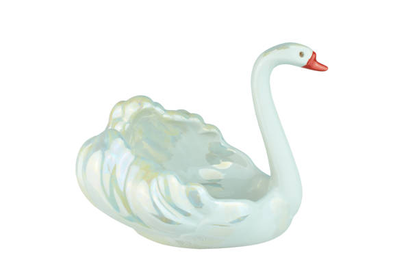 istock Ceramic swan isolated on the blue background 1370913384