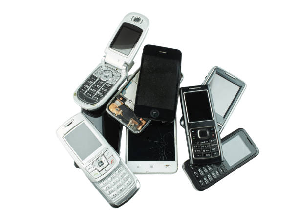 istock Old and obsolete cell phone isolated on white background. 1370913560