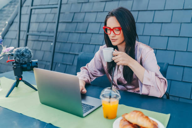 istock Influencer at home vlogging from the terrace 1370914589