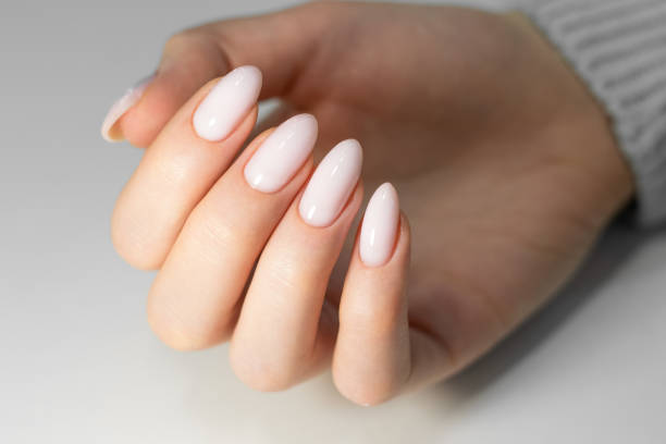 istock Beautiful nude manicure. 1370914602