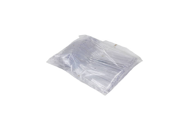 istock Packaging of transparent, plastic, disposable forks on a white background 1370918307