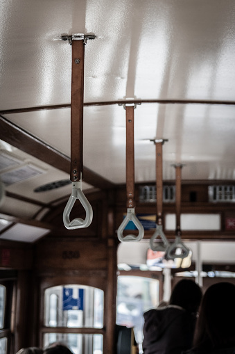 Detail of the old handles with leather strap in a Tram in Lisbon.