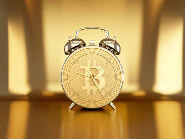 Gold coin alarm clock.Time is valuable.Business concept.3d rendering stock photo