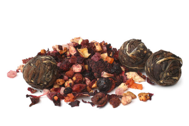 Chinese tea in the shape of a ball and fruit tea on white background