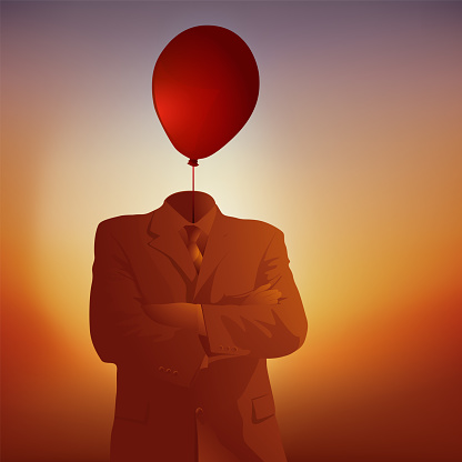 Concept of overwork and the need to clear one's head with the symbol of a businessman whose head is replaced by a balloon.