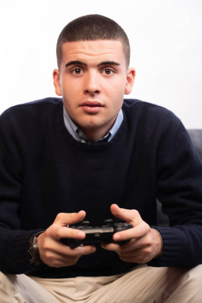 istock young men playing video games 1370928747