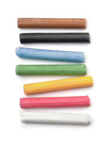 Top view of oil pastel sticks isolated on white