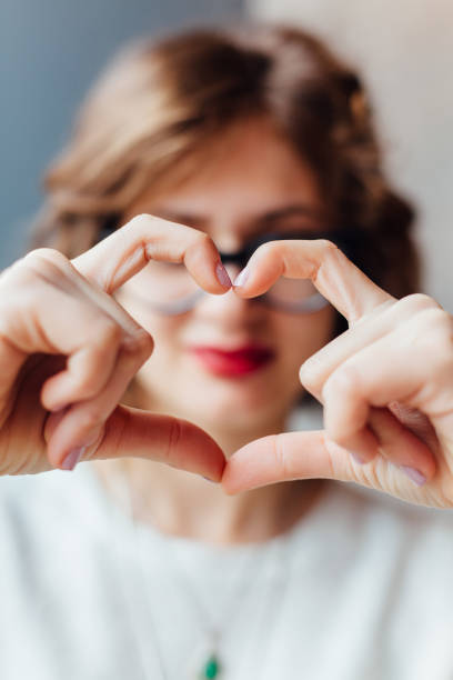 istock Woman Making Heart Shape With Hands 1370931833