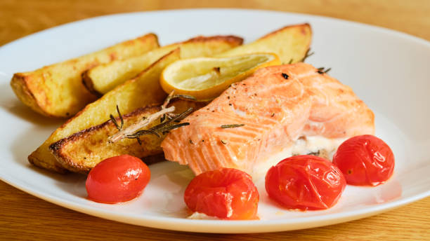istock Salmon fish with potatoes on plate 1370932689
