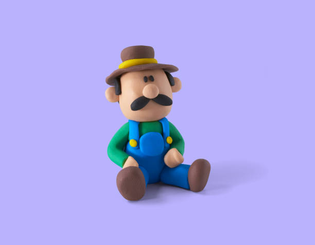 Farmer sitting on the ground, handmade from plasticine on a purple background