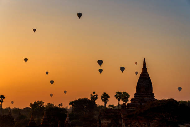 istock Sunset many hot air balloon with stupas in Bagan, Myanmar. 1370934686