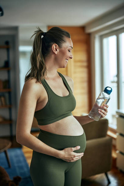 istock Pregnant woman hydrating during workout 1370936284