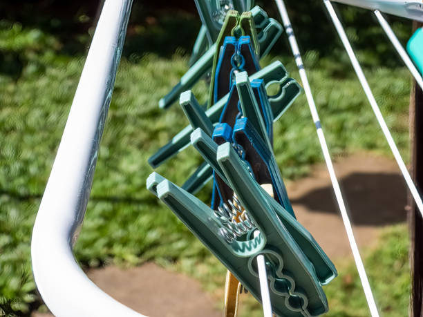 istock green and blue clothespin on white metal clothesline 1370936708