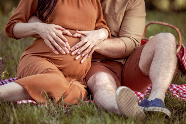istock Pregnant couple in love 1370936975
