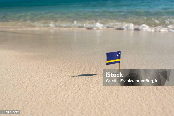 Flag On The Beach Stock Photo - Download Image Now - Curaçao, Sun, Flag