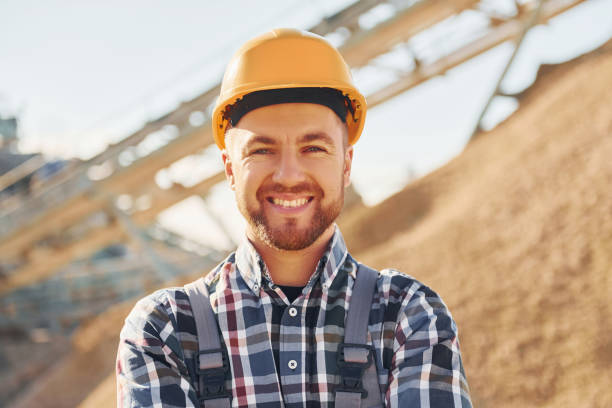 istock Positive man. Construction worker in uniform is on the quarry 1370938332