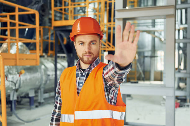 istock Looking forward. Construction worker in uniform is in the factory 1370938685
