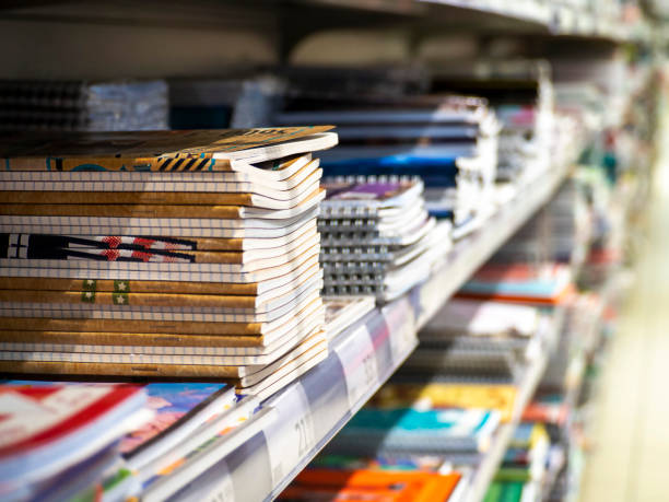 istock Stacks of notebooks on the shelf in the store. 1370939629