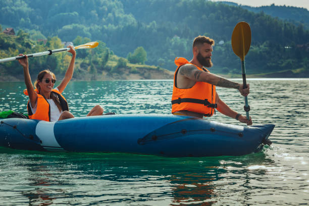istock Man and woman kayaking on lake 1370939991