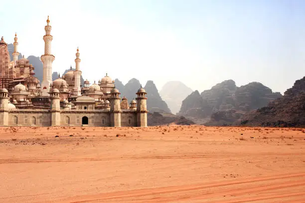Photo of A fabulous lost city in the desert. Fantastic oriental town in the sands and rocky mountains