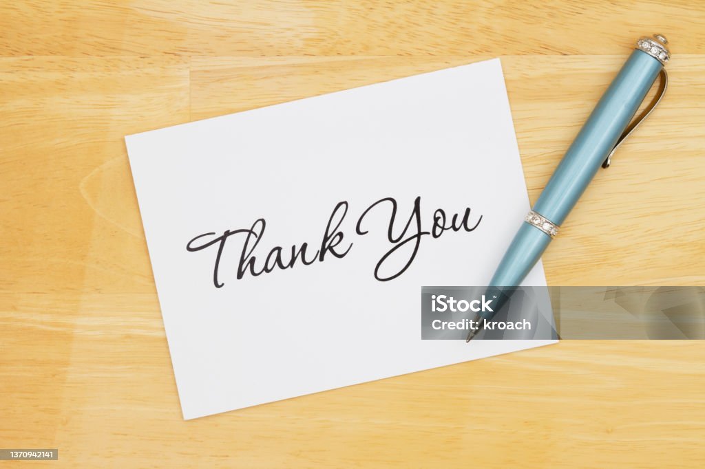 Thank you note with a pen on a desk Thank you greeting card with a pen on a desk Thank You - Phrase Stock Photo