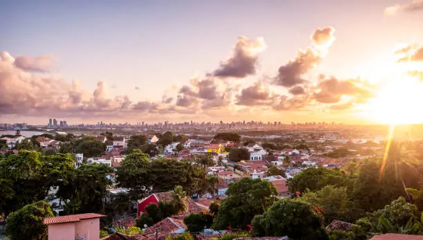 View of the Brazilian city of Olinda in Pernambuco, Brazil built in the 17th century showcasing its colonial buildings and its cobblestone streets at sunrise.