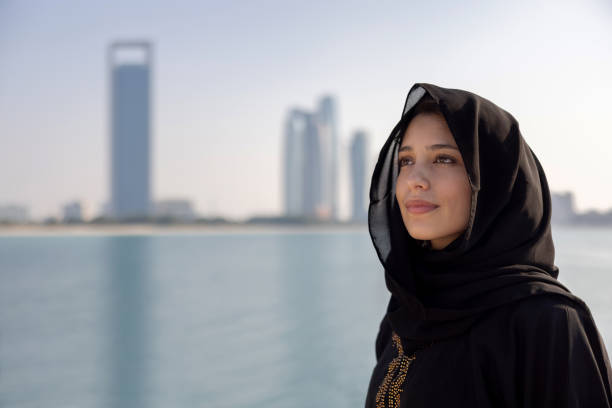 Midlle Eastern woman outdoors wearing a black hijab stock photo