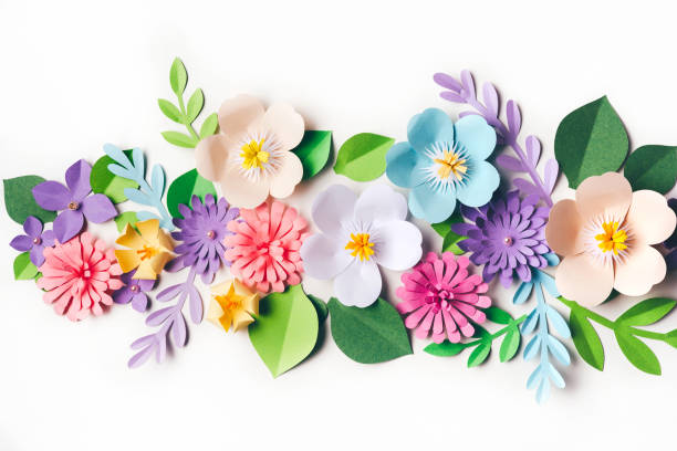 istock Paper flowers on white background 1370949643