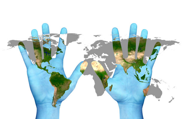 Close up hands and world map. NASA world map image layered and used; www.nasa.gov , https://www.flickr.com/photos/gsfc/sets/72157632172101342