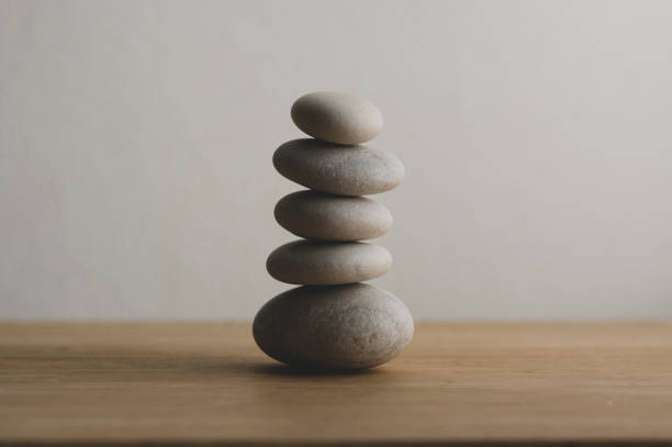 istock Stone cairn on white background, five stones tower, simple poise stones, simplicity harmony and balance, rock zen 1370953094