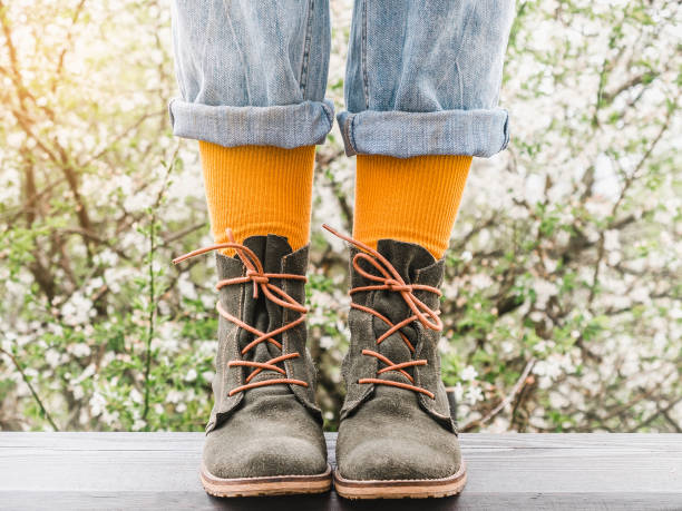 istock Trendy boots and colorful socks. Day light 1370953502