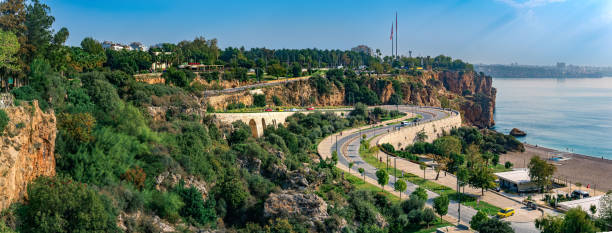 Antalya, Turkey - November 15, 2021: panoramic view of coastline with road, beach and coastal cliffs