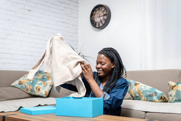 istock Unpacking clothes after online shopping 1370956996