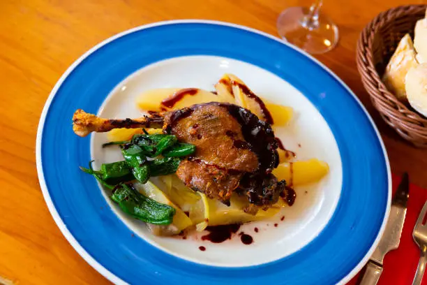 Photo of Duck confit in port with pear chutney