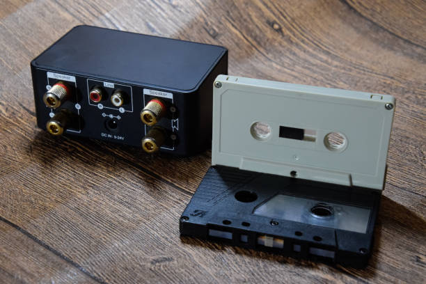 istock Audio cassette next to the amplifier on the table 1370960090