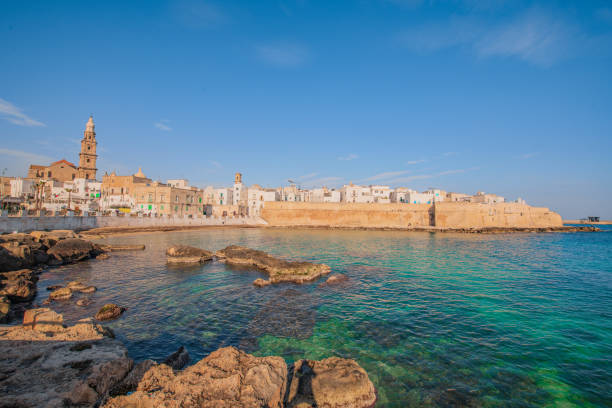 View of Monopoli The costal town of Monopoli and its walls monopoli puglia stock pictures, royalty-free photos & images