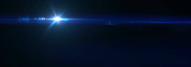 istock Blue background effect of glitter and   optical flares on black 1370966441
