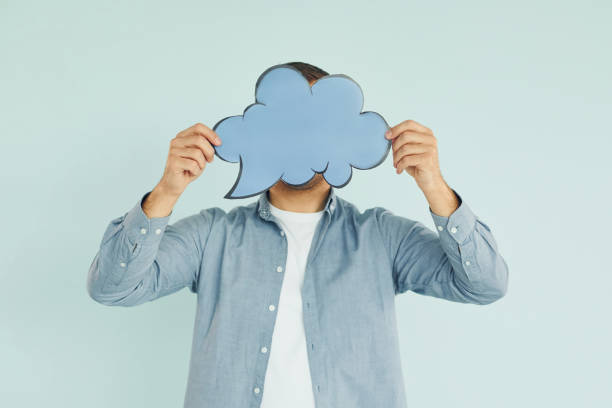 istock In casual clothes. Man standing in the studio with empty signs for the text 1370966784