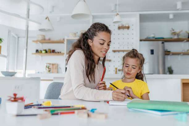 istock Caring mother study for school with her daughter 1370967694