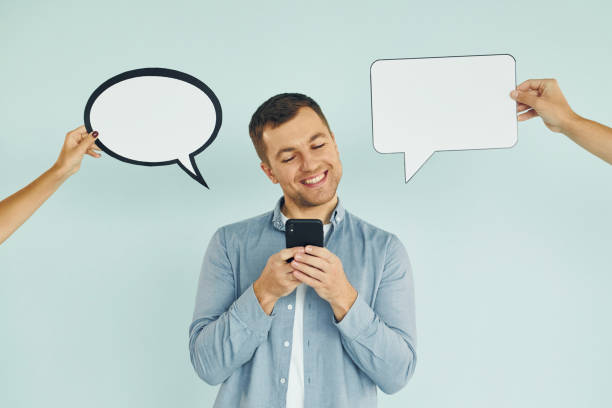 istock Smart person. Man standing in the studio with empty signs for the text 1370967711