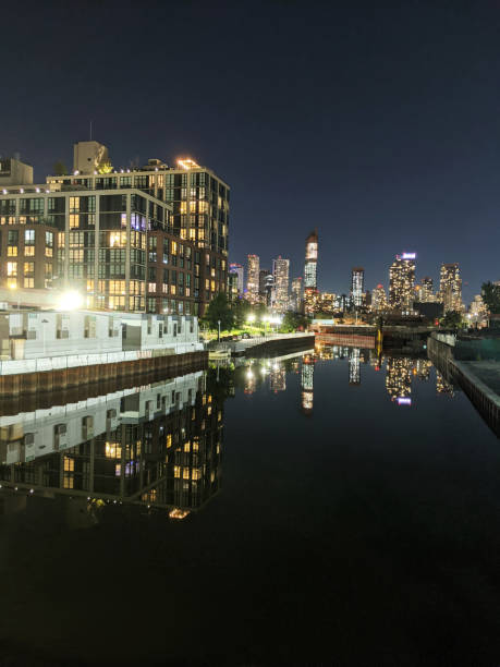 istock Skyscraper, towers in Downtown Brooklyn seen from Gowanus Canal at night 1370975124