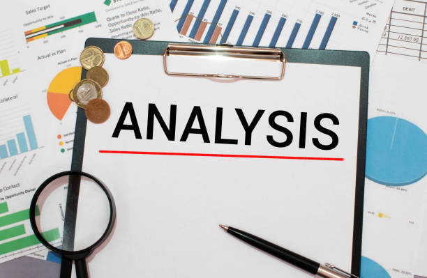 istock ANALYSIS word written in a notebook on a dark beautiful background with a magnifying glass. Business concept 1370976904