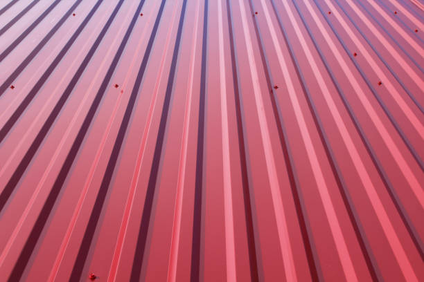 Red sheeting on the roof. Close-up. Vertical view. Background. Texture.