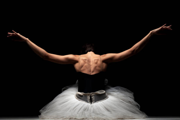 istock ballerina with a tutu posing on the floor 1370979063