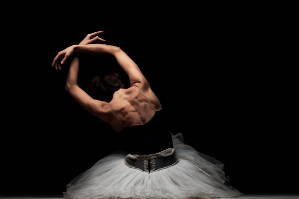 istock ballerina with a tutu posing on the floor 1370979067
