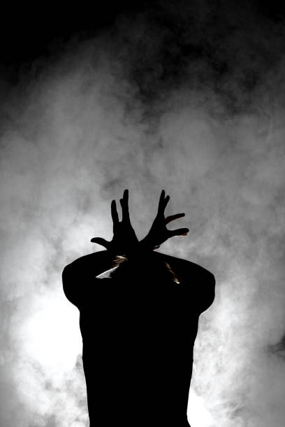 istock silhouette modern ballet dancer posing on dark background with smoke 1370979097