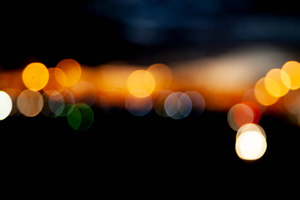 Defocused colorful city bokeh lights on black