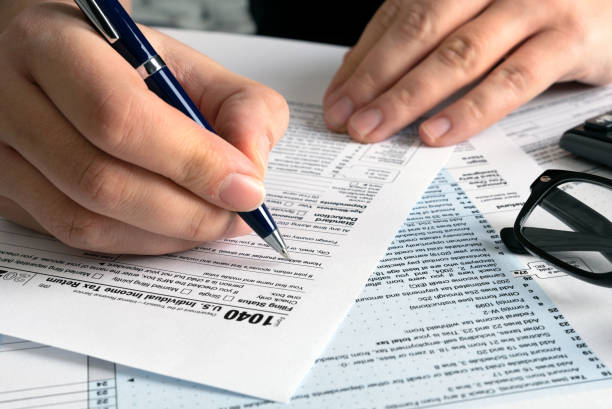 istock Tax return concept wits US 1040 tax form 1370980717